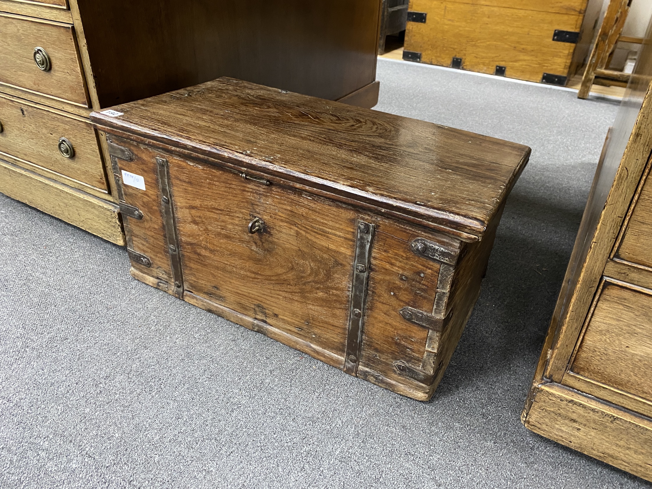 A small iron bound hardwood trunk, width 64cm, depth 34cm, height 34cm